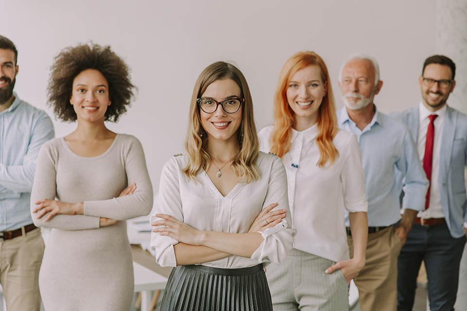 Line of happy and positive business people standing in the office massage